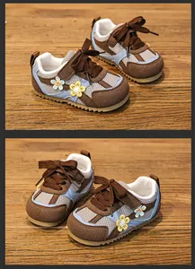 Detailed view of breathable mesh toddler girl sneakers with flower accents