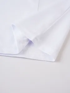 Close-up of white breathable mesh fabric and hem stitching on men's sport vest