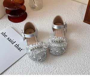 Detail of girls silver glitter princess shoes with transparent floral crystal trim