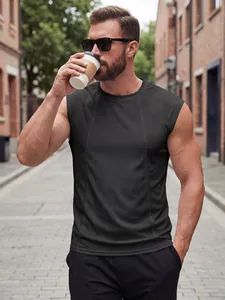 Close-up of men's breathable black mesh tank top worn by a model in an urban setting