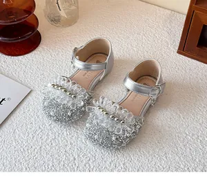 Sparkly silver princess shoes for girls featuring intricate beaded flower and pearl details.