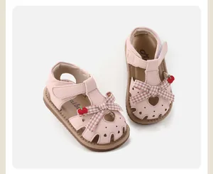 Sweet pink toddler girls' walking sandals with checkered bows and heart cutouts