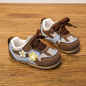Breathable mesh toddler shoes for girls with cute floral decorations and soft soles.