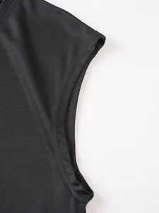 Close-up detail of armhole and breathable mesh fabric on men's black tank top