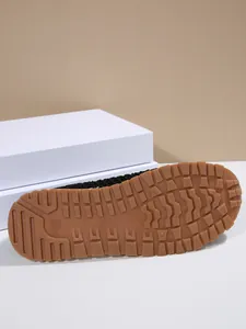 Detailed view of the textured non-slip gum rubber outsole of women's casual sneakers