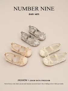 Detailed view of three pairs of girls' hollow-out mesh princess shoes with floral patterns