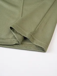 Close-up of the breathable mesh fabric and durable stitching of a men's outdoor tank top