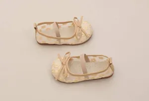 Detailed view of beige mesh girl's Mary Jane princess shoes with yellow floral embroidery