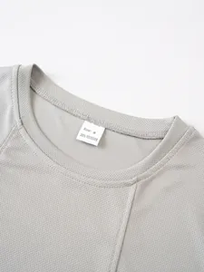 Detail view of men's breathable mesh tank top collar with 100% polyester tag