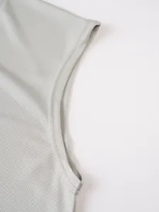Close-up of breathable mesh fabric and durable stitching on a men's gray tank top