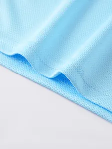 Close-up macro view of light blue breathable mesh fabric and hem stitching detail.