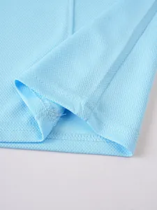 Detail view of breathable light blue mesh fabric vest hem with durable stitching