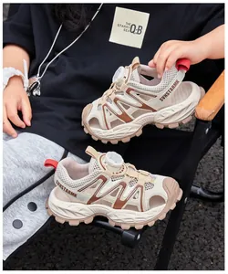 Detailed view of breathable beige mesh closed-toe boys sports sandals in a lifestyle setting