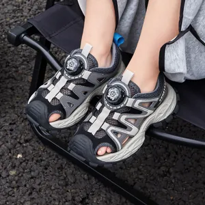 Breathable boys' closed-toe athletic sandals featuring quick-adjust rotary buckle
