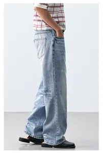 Side view of light blue loose straight-leg jeans for a cleanfit aesthetic look