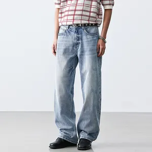 Men's light blue wash loose fit straight-leg denim jeans in minimalist clean fit style