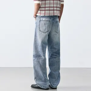 Relaxed-fit light wash straight-leg denim jeans featuring a unique crinkled knee design for men
