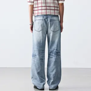 Men's light blue loose straight-leg denim jeans with cleanfit washed design back view