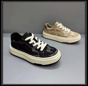 Detail view of stylish black and beige thick-sole canvas sneakers with graphic patterns