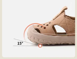 Close-up of toddler leather sandal showing the 15-degree ergonomic anti-collision toe design.