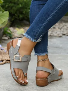 Detailed view of gray women's thong sandals featuring a sparkling rhinestone square buckle