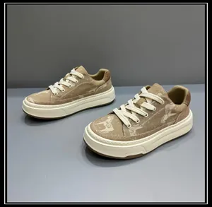 Close-up of the khaki canvas shoes featuring dog patterns and thick white platform soles