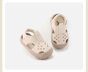 Top-down view of cream toddler sandals with breathable hollow design and soft sole.