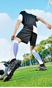 Professional high-top soccer cleats with firm ground studs for intense athletic training