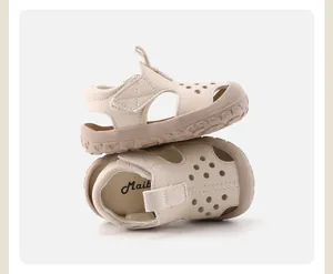Detail view of beige breathable toddler sandals with hollow design and velcro strap