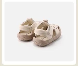 Detail view showing the heel and textured non-slip sole of cream children's sandals