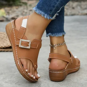 Stylish women's wedge sandals featuring rhinestone buckle and elastic back strap