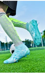 Professional high-top soccer cleats with long studs for training on grass pitch