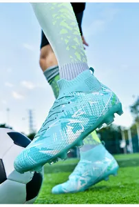 Detailed close-up of professional high-top soccer cleats with firm ground studs.
