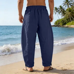 Rear view of men's navy blue loose linen harem pants for summer beach activities