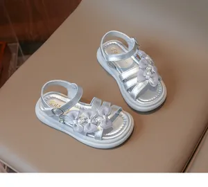 Detailed view of silver girls princess sandals featuring delicate mesh bows and pearls