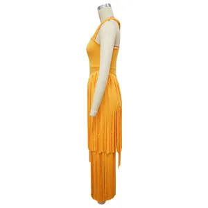 Side view macro detail of an elegant yellow solid color fringe maxi dress on mannequin