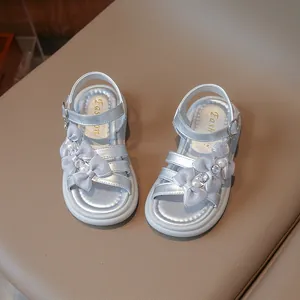 Silver girls' princess sandals with decorative mesh bows and elegant pearl accents.