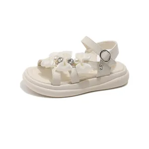 Elegant cream-white girl's princess sandals with bows and pearl decorations