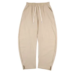 Khaki linen casual harem pants for men with drawstring waist and paneled design