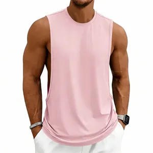 Front detail view of a men's loose-fit pink athletic gym tank top on a male model