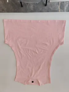 Detail view of pink men's basketball vest showing crew neck and armhole stitching