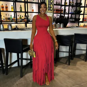Elegant red one-shoulder fringe maxi dress for women in a luxury night bar setting
