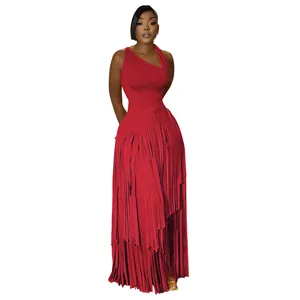 Detailed view of a red one-shoulder evening gown featuring a layered fringe maxi skirt