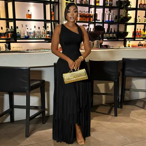 Detailed view of an elegant black one-shoulder maxi dress featuring tiered fringe layers