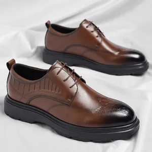 Classic brown men's dress shoes featuring crocodile texture and gradient toe detail