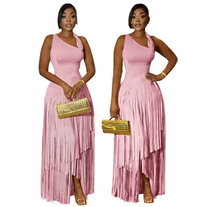Close-up detail of elegant pink one-shoulder maxi dress with tiered fringe design.
