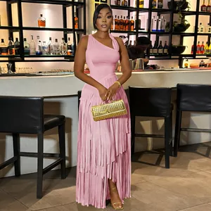 Close-up of pink one-shoulder maxi dress with long fringe details for evening wear
