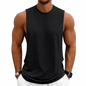 Front view of men's loose black gym tank top with deep armholes on model