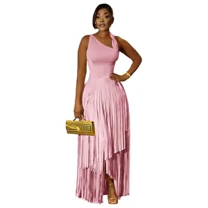 Full view of elegant pink sleeveless dress featuring layered fringe skirt and slim fit.