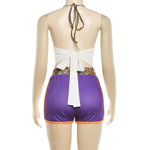Back view of a sexy white halter neck top and purple shorts set on a mannequin
